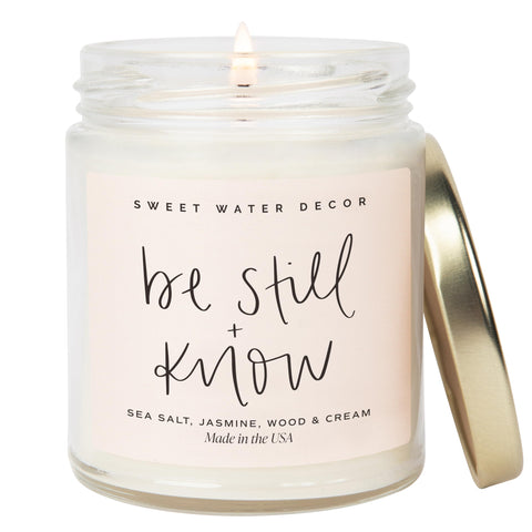 Sweet Water Decor, Be Still and Know, Sea Salt, Jasmine, Cream, and Wood Scented Soy Wax Candle for Home | 9oz Clear Jar, 40 Hour Burn Time, Made in the USA