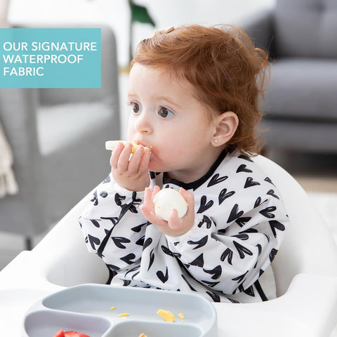 Bumkins Sleeved Bib for Girl or Boy, Baby and Toddler for 6-24 Months, Essential Must Have for Eating, Feeding, Baby Led Weaning Supplies, Long Sleeve Mess Saving Food Catcher, Hearts Black and White