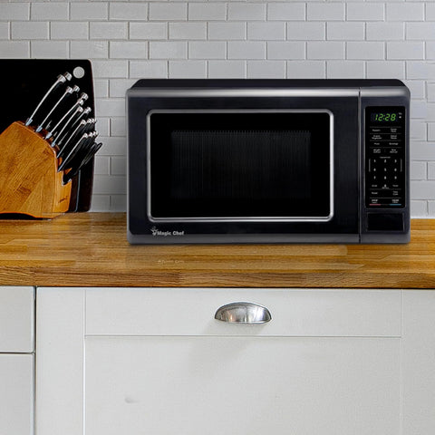 Magic Chef 0.7 cu. ft. Countertop Microwave in Black - 700W (10.1"H x 17"W x 12.5"D) MC77MB