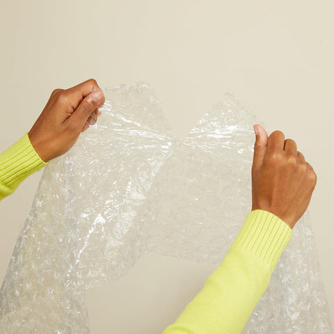 Amazon Basics Bubble Cushioning Wrap for Moving, Packing, Shipping and Storage, Heavy Duty Protection for Fragile Items, 12-inch x 100-foot Long Roll, Large 5/16", Clear