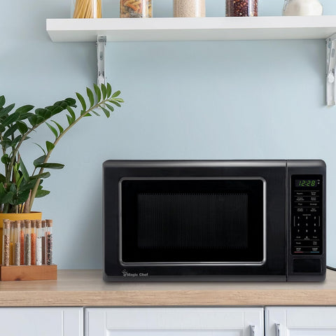 Magic Chef 0.7 cu. ft. Countertop Microwave in Black - 700W (10.1"H x 17"W x 12.5"D) MC77MB